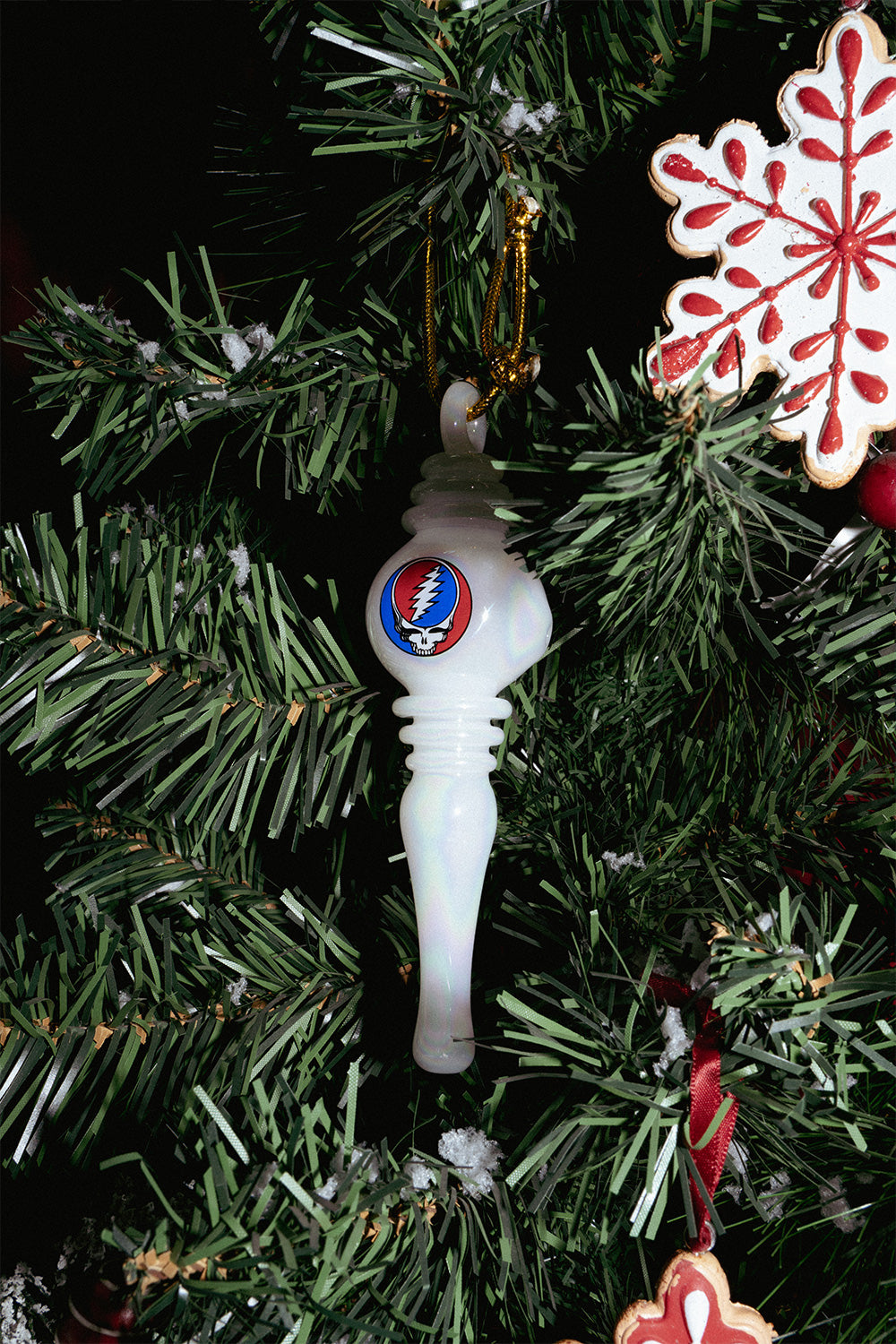 Grateful Dead 6" Holiday Ornament Hand Pipe - White glass hand pipe ornament with a Grateful Dead logo, hanging from a Christmas tree.