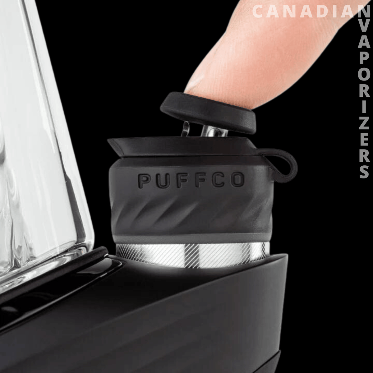 Puffco New Peak Pro 3DXL - Black Puffco Peak Pro 3DXL with textured chamber and glass attachment, pressed by a finger on top.