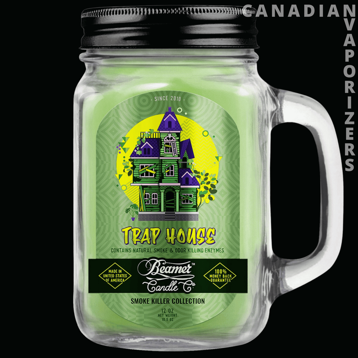 Beamer Candle Co Smoke Odor Exterminator 12oz Candle - Clear glass mason jar candle with a black lid, handle, and bright green haunted house label.