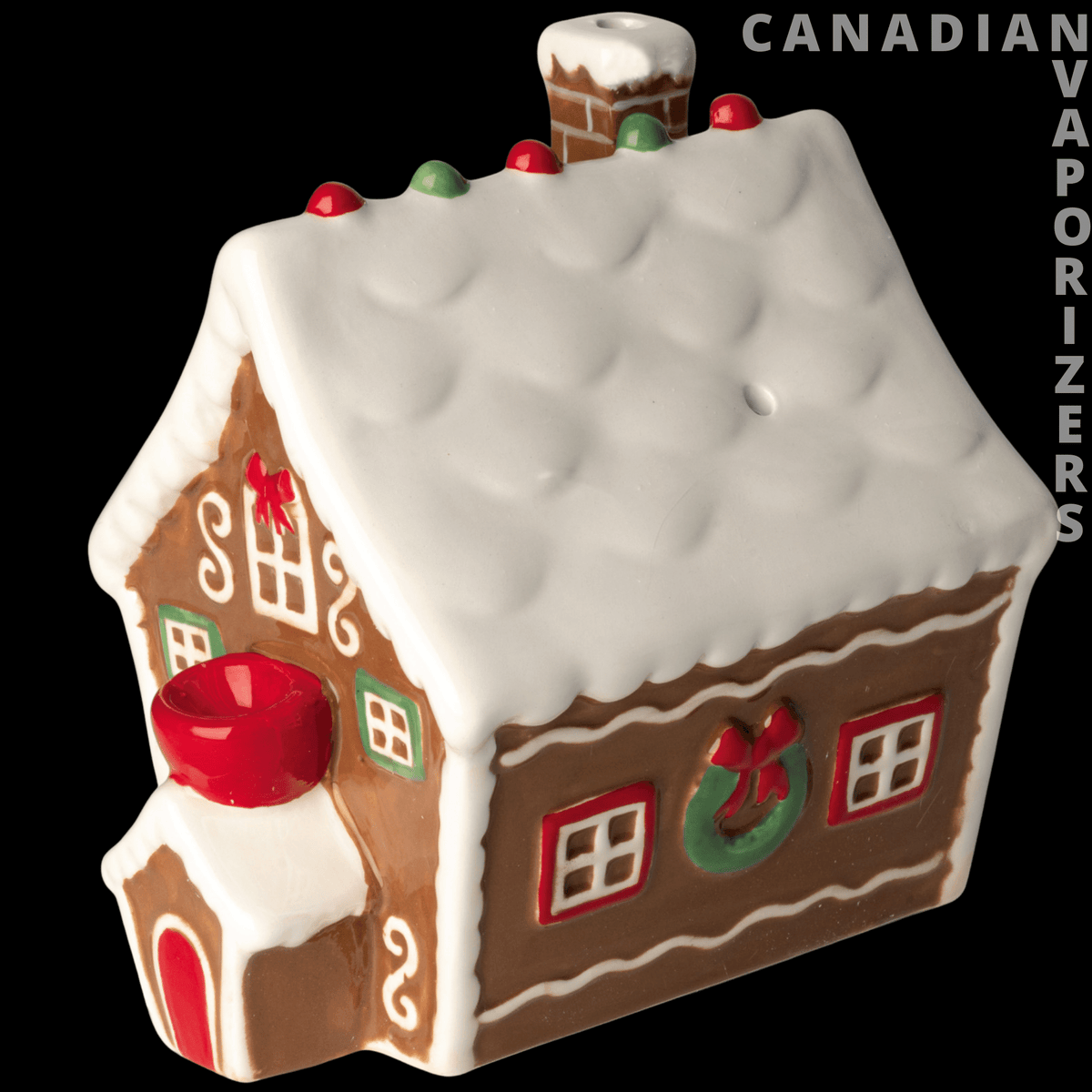 Ceramic Gingerbread House Pipe - Ceramic gingerbread house pipe with a white icing-style roof, brown walls, red door, and wreath details.