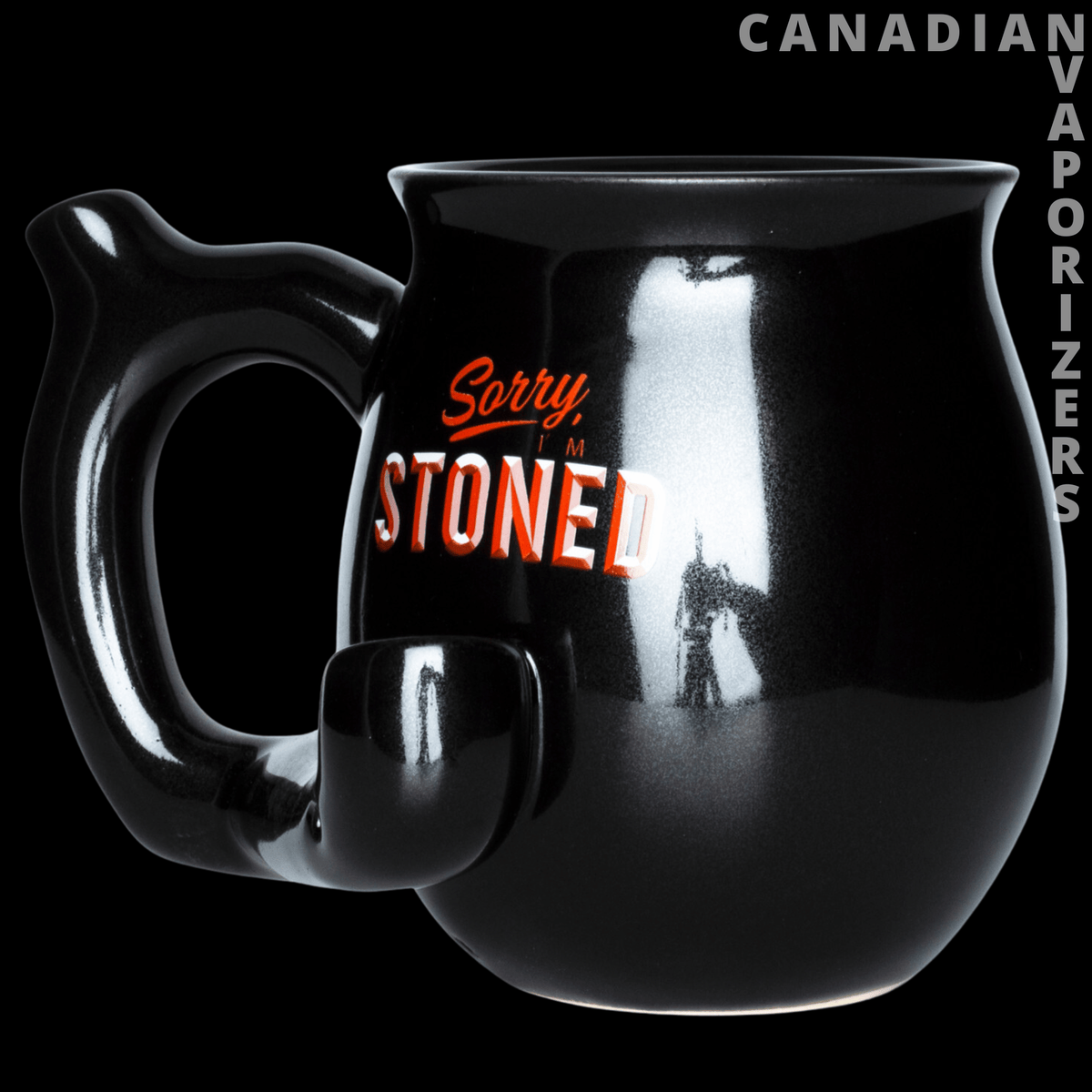 Mug Pipe - Glossy black ceramic mug pipe with a side handle and small bowl, printed “Sorry, I’m Stoned” in red and orange.