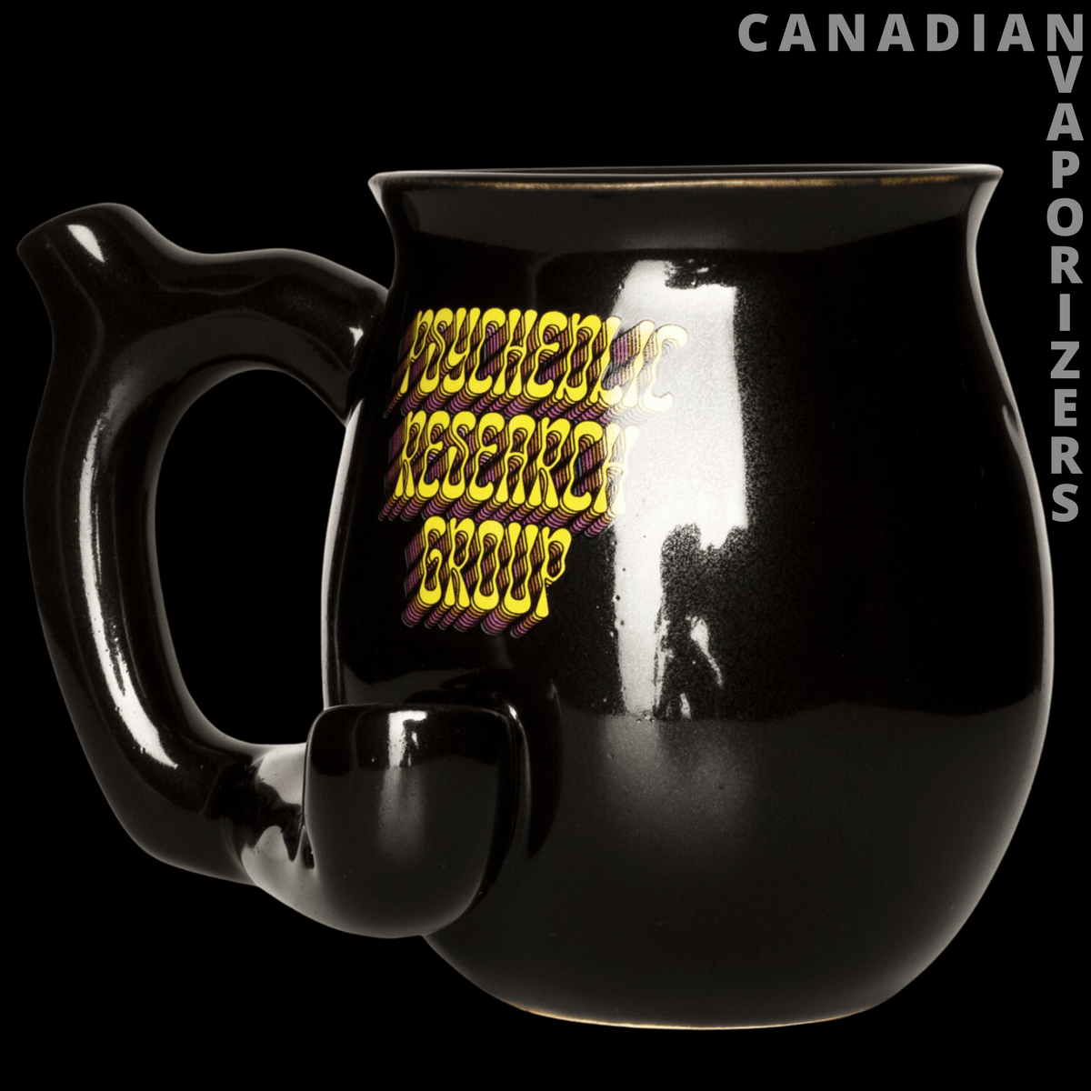 Mug Pipe - Glossy black mug pipe with a side-mounted bowl and yellow “Psychedelic Research Group” lettering.