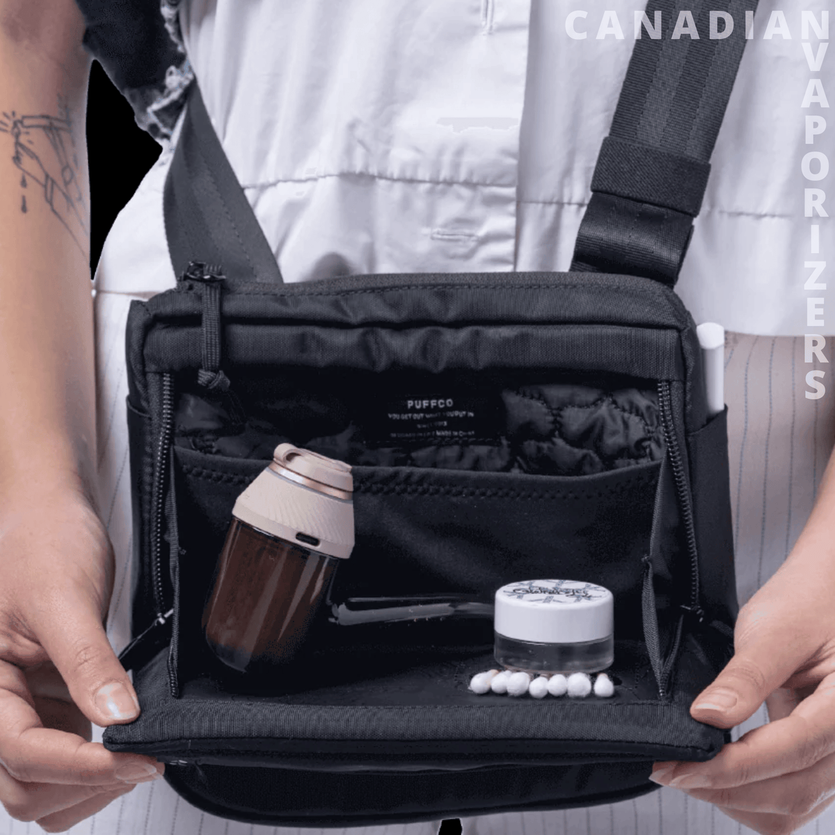 Proxy Travel Bag - Black travel bag with an open organizer compartment, holding a travel mug and small toiletry container.