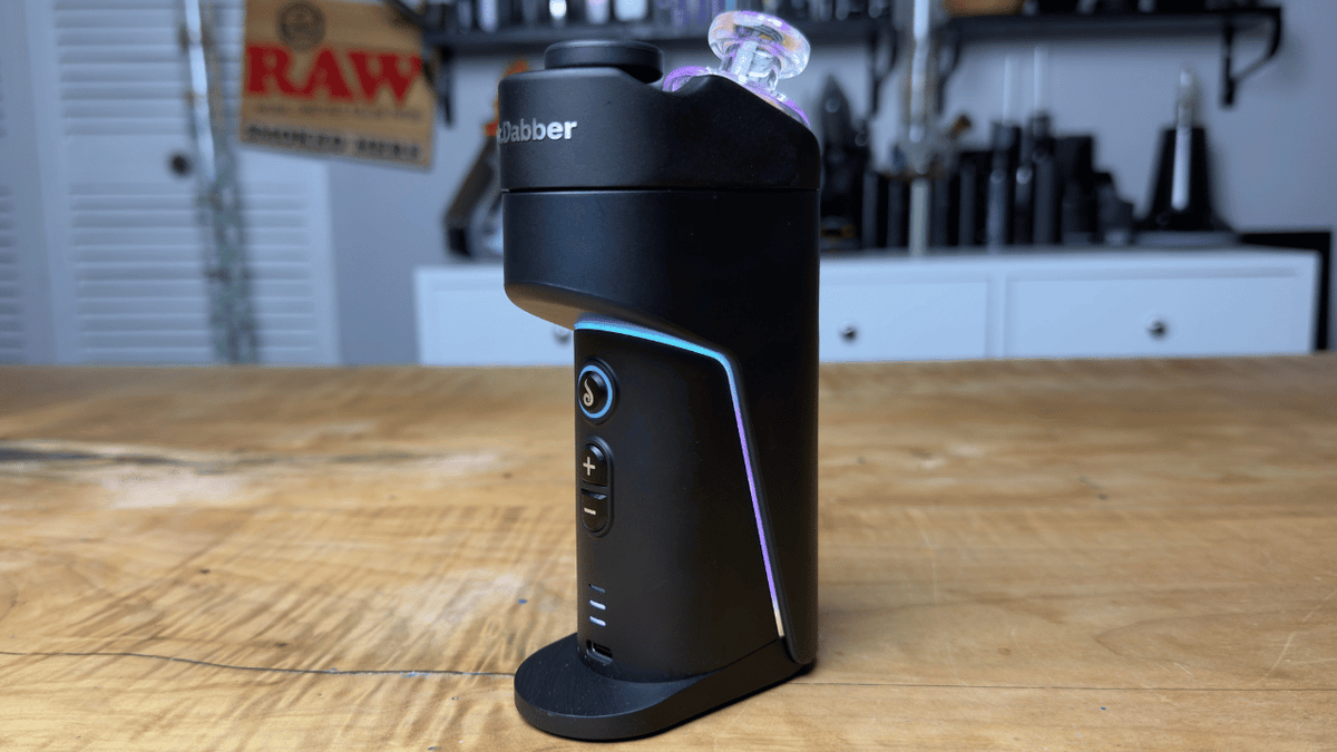 Dr Dabber Switch Go sitting on table with custom lights on