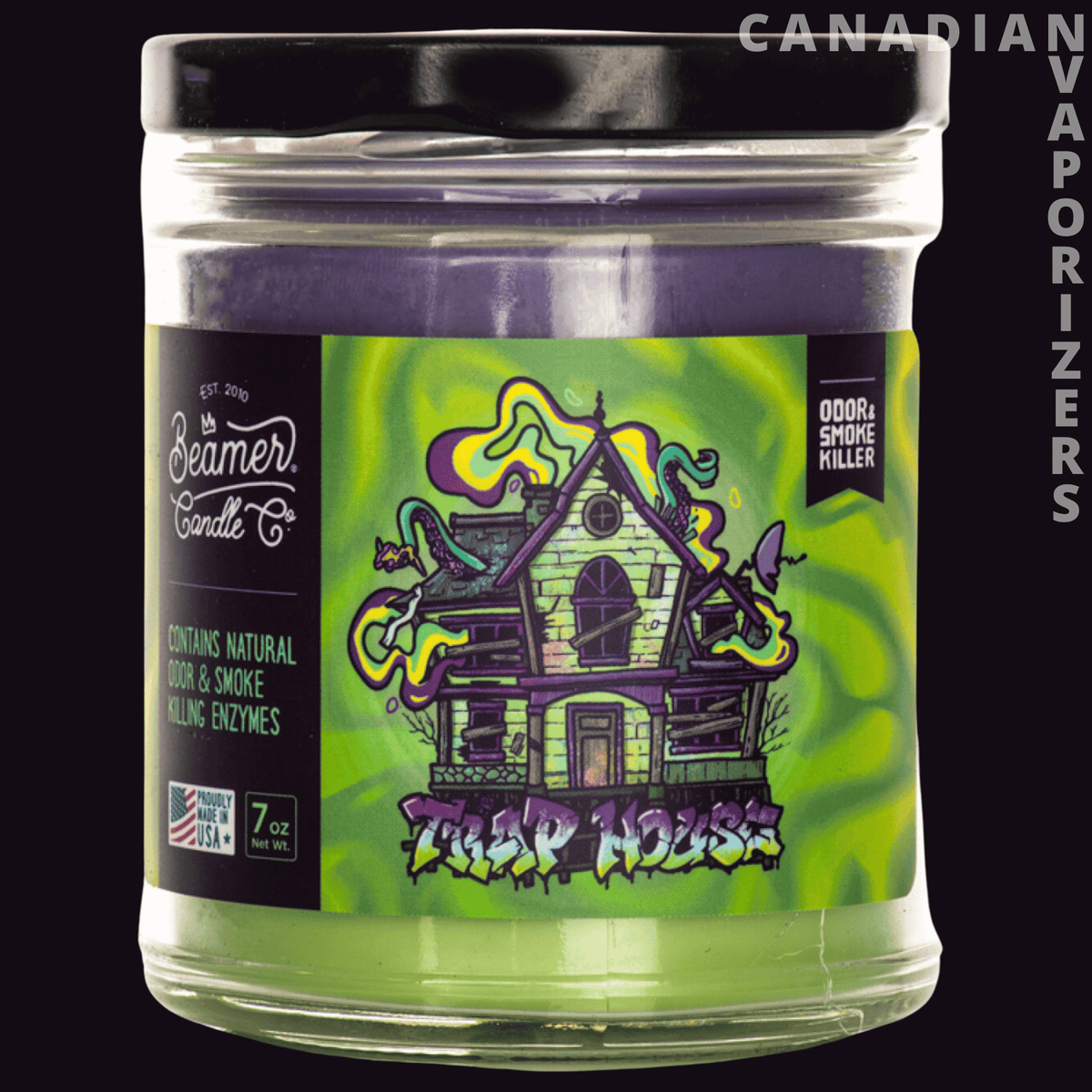 Beamer Candle Co 7oz Trap House Candle - Clear glass candle jar with a bright green, illustrated haunted-house label and black lid.