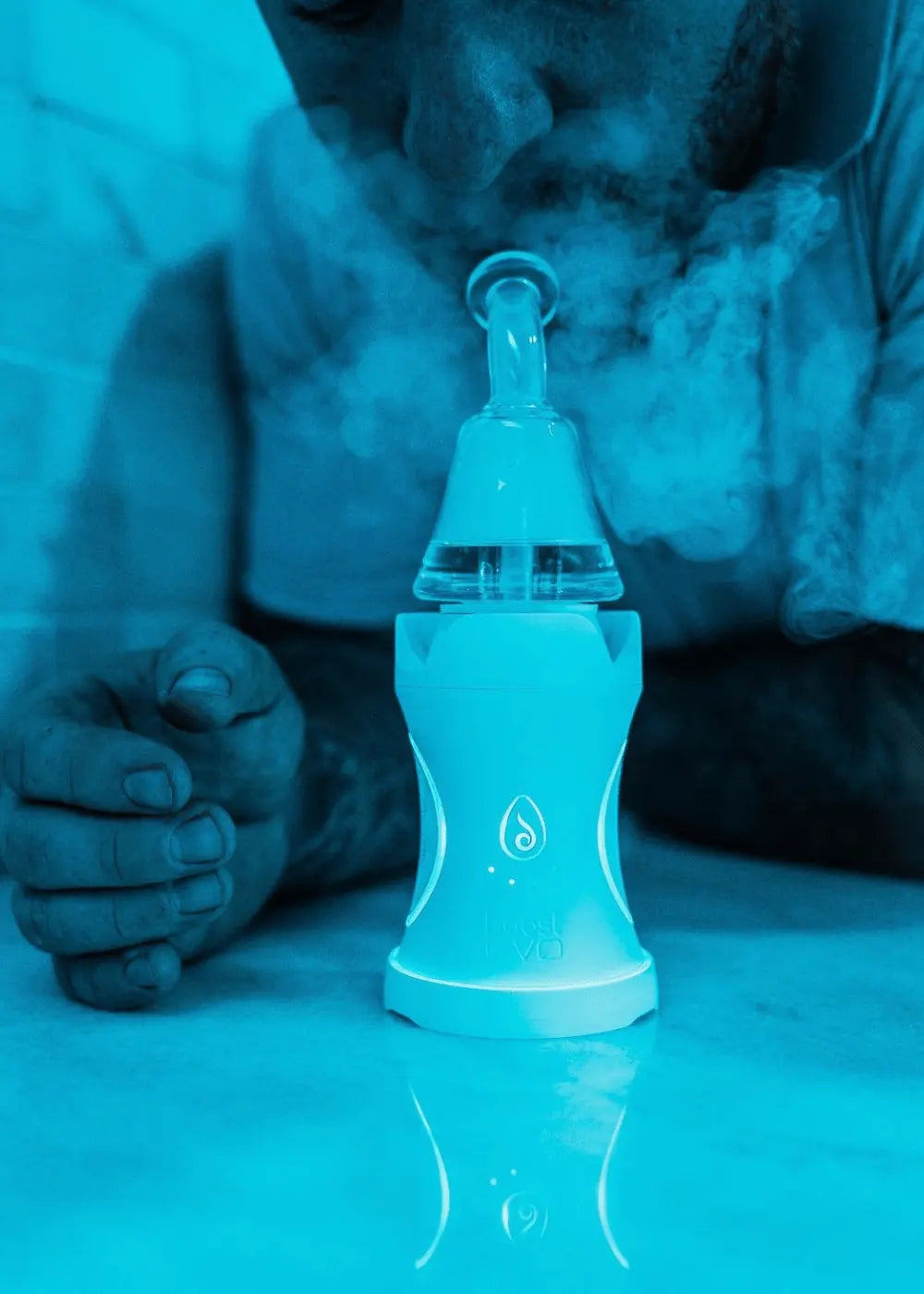 Man inhaling from Dr. Dabber Boost Evo