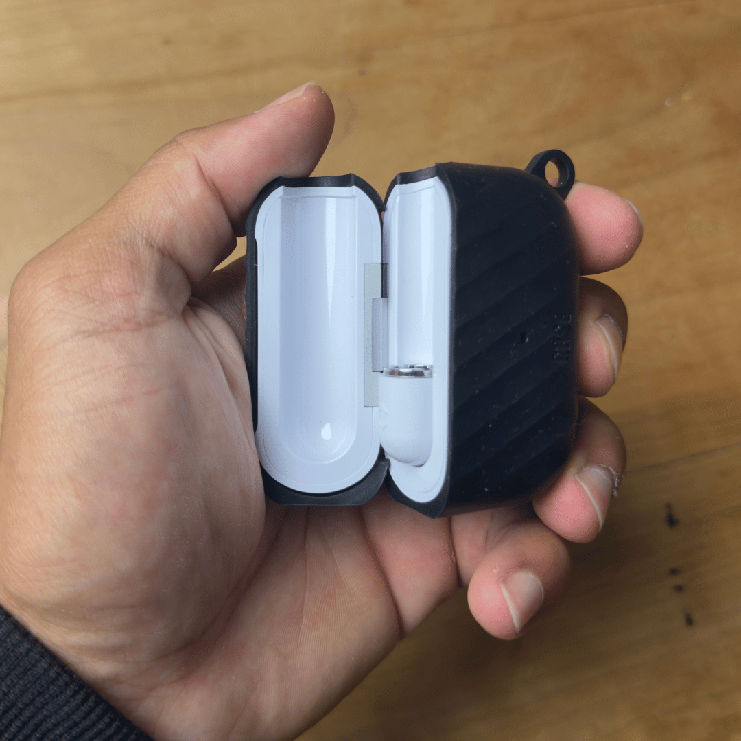 Yocan Black Case Cartridge 510 Battery - Compact black-and-white clamshell 510 battery with a ridged black shell, held open in a hand.