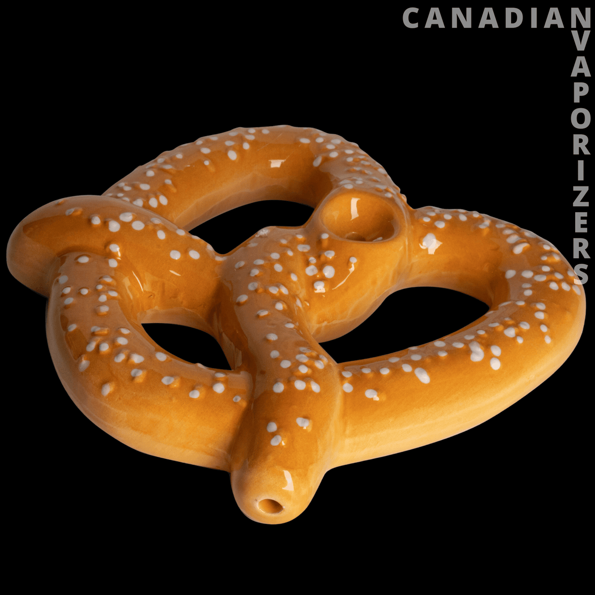 Ceramic Pretzel Hand Pipe - Glossy brown ceramic hand pipe shaped like a twisted pretzel with white salt-like dots and a small bowl opening.