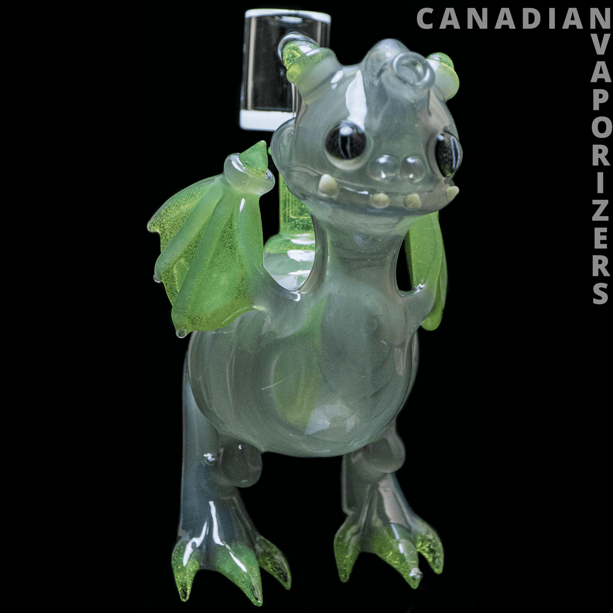 Dragon By Friday Glass - Translucent green dragon-shaped glass bong with leafy wings, rounded snout, and clawed feet.