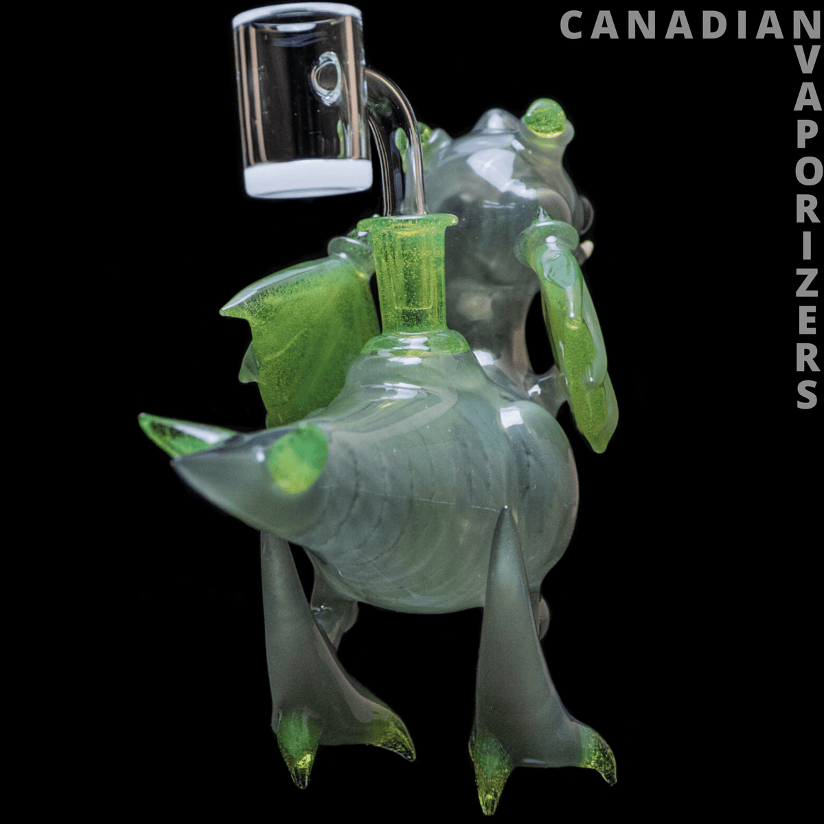Dragon By Friday Glass - Hand-blown glass dragon water pipe with translucent green wings, horns, and feet, plus a clear upright mouthpiece.
