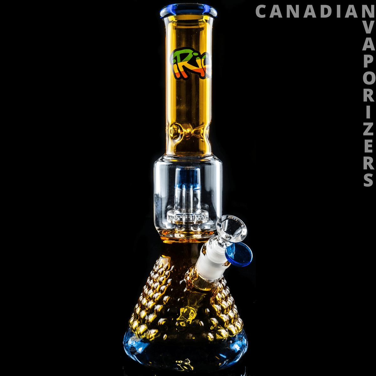 iRie | Yellow/Blue 13.5" Dual Chamber Beaker Tube - Yellow and blue glass dual-chamber beaker bong with a patterned amber base and tall decorated neck.