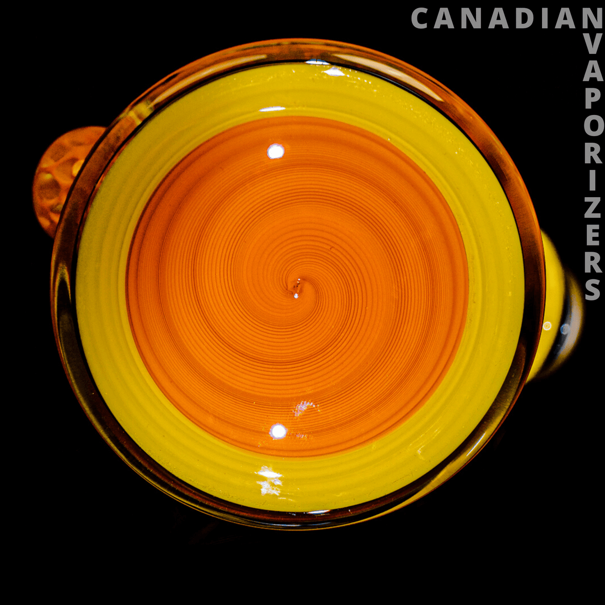 PHAT ASS GLASS - Round heady glass piece with a vivid orange spiral center, bright yellow rim, and amber accents.