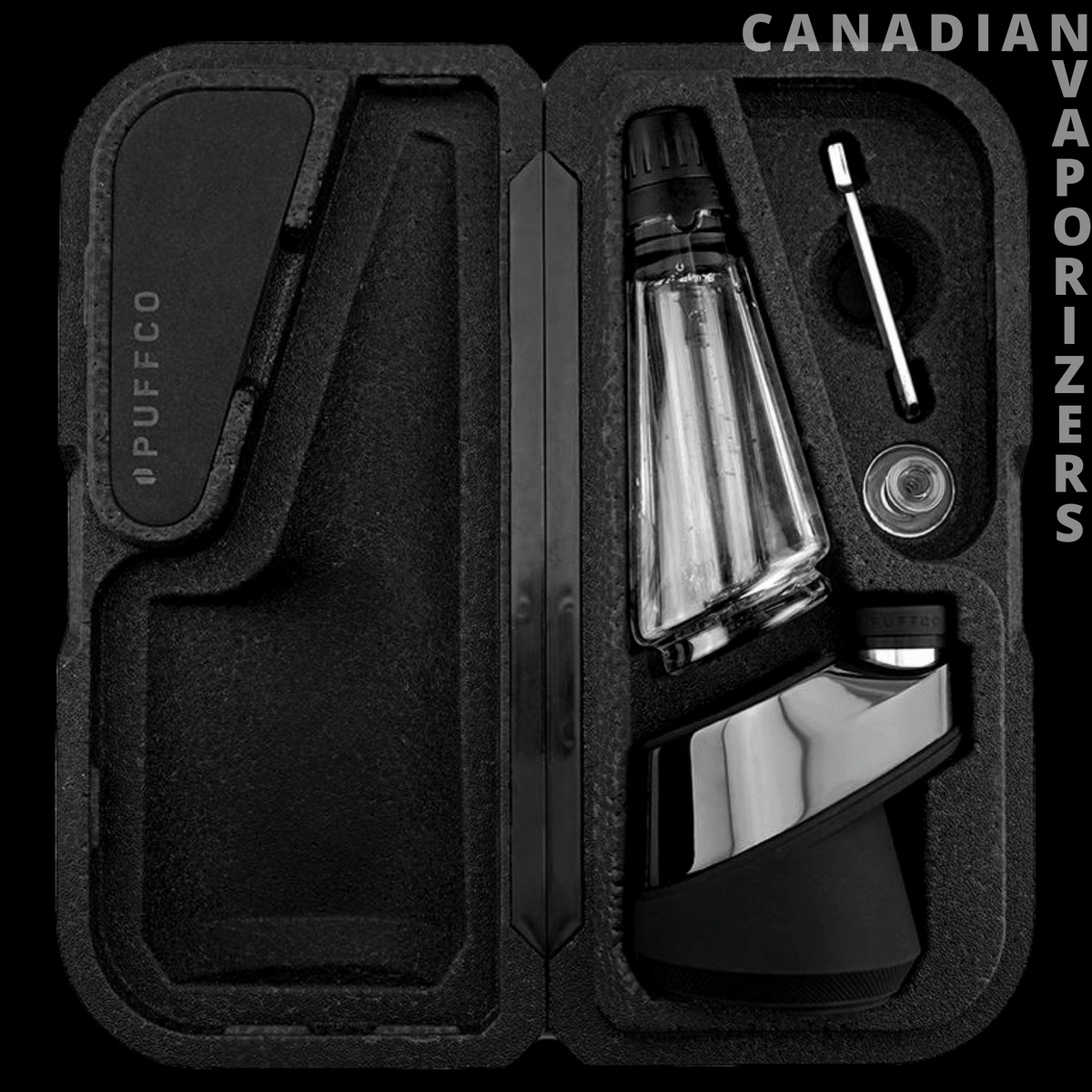 Puffco Peak Pro Travel Glass - Open black foam travel case with a clear glass attachment, metal tool, and black-and-silver base.