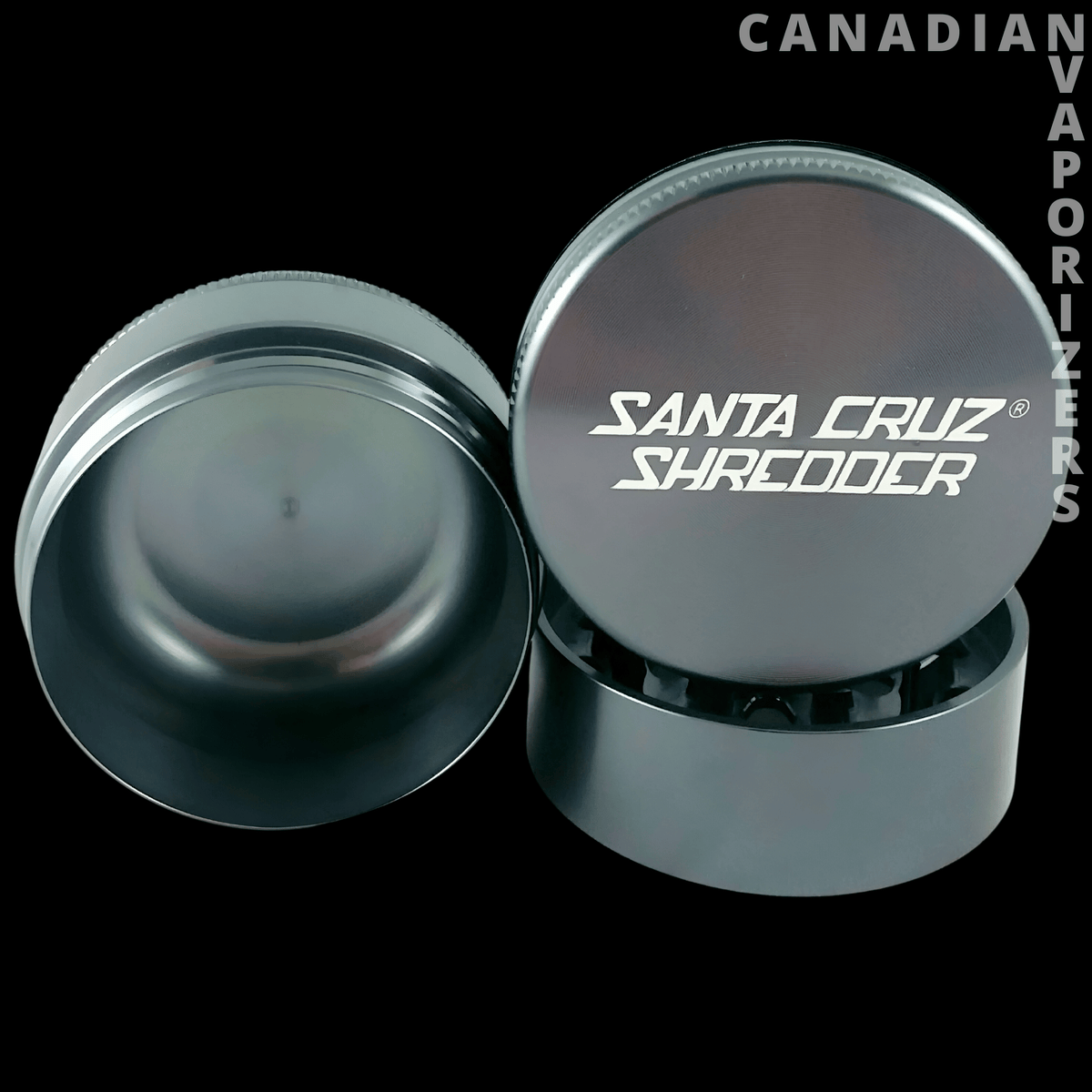 Santa Cruz Shredder 3-Piece Grinder Large 2.75" - Gunmetal grey Santa Cruz Shredder three-piece grinder with branded lid and toothed interior.