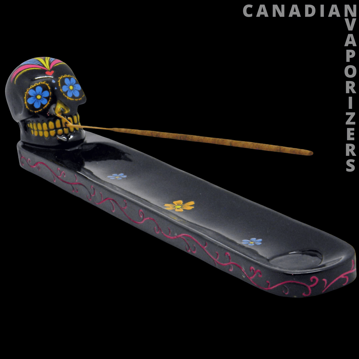 Skull Incense Holder - Black skull incense holder with colorful floral details and a long tray featuring red vine accents.