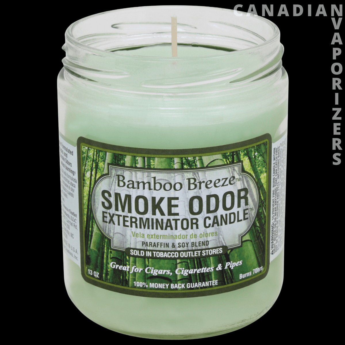 Smoke Odor Exterminator 13Oz Candle - Pale green Smoke Odor Exterminator candle in a clear glass jar with a bamboo breeze label and single wick.
