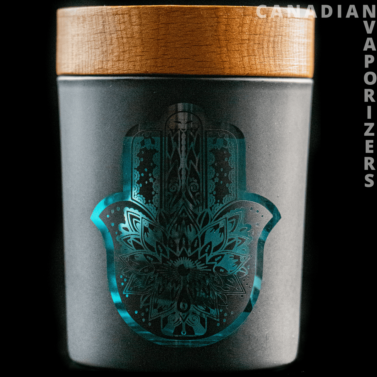 V-Syndicate Hamsa Smart Stash Jar - Grinder and Stash Jar - Gray metal Hamsa stash jar with a turquoise hand design and a wood-grain grinder lid.